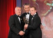 15 October 2010; Tommy Walsh, Kilkenny, is presented with his GAA Hurling All-Star award by Uachtarán Chumann Lúthchleas Gael Criostóir Ó Cuana and Jeroen Hoencamp, CEO, Vodafone Ireland, during the 2010 GAA All-Stars Awards, sponsored by Vodafone. Citywest Hotel & Conference Centre, Saggart, Co. Dublin. Picture credit: Brendan Moran / SPORTSFILE