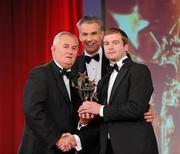 15 October 2010; JJ Delaney, Kilkenny, is presented with his GAA Hurling All-Star award by Uachtarán Chumann Lúthchleas Gael Criostóir Ó Cuana and Jeroen Hoencamp, CEO, Vodafone Ireland, during the 2010 GAA All-Stars Awards, sponsored by Vodafone. Citywest Hotel & Conference Centre, Saggart, Co. Dublin. Picture credit: Brendan Moran / SPORTSFILE