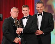 15 October 2010; Brendan Maher, Tipperary, is presented with his GAA Hurling All-Star award by Uachtarán Chumann Lúthchleas Gael Criostóir Ó Cuana and Jeroen Hoencamp, CEO, Vodafone Ireland, during the 2010 GAA All-Stars Awards, sponsored by Vodafone. Citywest Hotel & Conference Centre, Saggart, Co. Dublin. Picture credit: Brendan Moran / SPORTSFILE