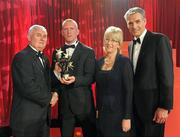15 October 2010; John Mullane, Waterford, is presented with his GAA Hurling All-Star award by Uachtarán Chumann Lúthchleas Gael Criostóir Ó Cuana and Jeroen Hoencamp, CEO, Vodafone Ireland, during the 2010 GAA All-Stars Awards, sponsored by Vodafone. Citywest Hotel & Conference Centre, Saggart, Co. Dublin. Picture credit: Ray McManus / SPORTSFILE