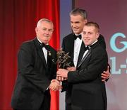 15 October 2010; Noel Connors, Waterford, is presented with his GAA Hurling All-Star award by Uachtarán Chumann Lúthchleas Gael Criostóir Ó Cuana and Jeroen Hoencamp, CEO, Vodafone Ireland, during the 2010 GAA All-Stars Awards, sponsored by Vodafone. Citywest Hotel & Conference Centre, Saggart, Co. Dublin. Picture credit: Brendan Moran / SPORTSFILE