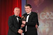 15 October 2010; Paul Curran, Tipperary, is presented with his GAA Hurling All-Star award by Uachtarán Chumann Lúthchleas Gael Criostóir Ó Cuana and Jeroen Hoencamp, CEO, Vodafone Ireland, during the 2010 GAA All-Stars Awards, sponsored by Vodafone. Citywest Hotel & Conference Centre, Saggart, Co. Dublin. Picture credit: Brendan Moran / SPORTSFILE