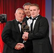 15 October 2010; Noel McGrath, Tipperary, is presented with his GAA Hurling All-Star award by Uachtarán Chumann Lúthchleas Gael Criostóir Ó Cuana and Jeroen Hoencamp, CEO, Vodafone Ireland, during the 2010 GAA All-Stars Awards, sponsored by Vodafone. Citywest Hotel & Conference Centre, Saggart, Co. Dublin. Picture credit: Brendan Moran / SPORTSFILE