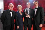 15 October 2010; Lar Corbett, Tipperary, is presented with his GAA Hurling All-Star Player of the Year award by Uachtarán Chumann Lúthchleas Gael Criostóir Ó Cuana, Mary Hanafin TD, Minister for Tourism, Culture and Sport, and Jeroen Hoencamp, CEO, Vodafone Ireland, during the 2010 GAA All-Stars Awards, sponsored by Vodafone. Citywest Hotel & Conference Centre, Saggart, Co. Dublin. Picture credit: Brendan Moran / SPORTSFILE