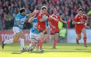 16 October 2010; Johne Murphy, Munster, is tackled by Laurent Emmanuelli and Joe van Niekerk, Toulon. Heineken Cup Pool 2, Round 2, Munster v Toulon, Thomond Park, Limerick. Picture credit: Matt Browne / SPORTSFILE