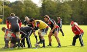 19 October 2010; Munster forwards John Hayes, Alan Quinlan and Tony Buckley are watched by forwards coach Laurie Fisher, right, during squad training ahead of their Celtic League game against Benetton Treviso on Friday night. Munster Rugby squad training, University of Limerick, Limerick. Picture credit: Brendan Moran / SPORTSFILE