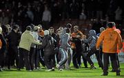 19 October 2010; Supporters clash with each other and security staff at the end of the game. FAI Ford Cup Semi-Final Replay, St Patrick's Athletic v Shamrock Rovers, Richmond Park, Inchicore, Dublin. Picture credit: SPORTSFILE