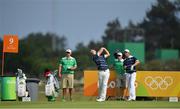 9 August 2016; Seamus Power of Ireland drives from a tee box watched by Padraig Harrington and their caddies John Rathouz and Ronan Flood, during a practice round ahead of the Men's Strokeplay competition at the Olympic Golf Course, Barra de Tijuca, during the 2016 Rio Summer Olympic Games in Rio de Janeiro, Brazil. Photo by Brendan Moran/Sportsfile