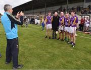 9 August 2016; Former Wexford manager Liam Griffin takes a photograph of Ronnie Delany, winner of the gold medal in the 1,500m in the 1956 Olympic Games in Melbourne, Australia with former Kilkenny players including DJ Carey and Charlie Carter  pictured at the fifth annual Hurling for Cancer Research, a celebrity hurling match in aid of the Irish Cancer Society in St Conleth’s Park, Newbridge. Ireland's top GAA and horseracing stars lined out for the game, organised by horseracing trainer Jim Bolger and National Hunt jockey Davy Russell. To date the event has raised €400,000 for the Irish Cancer Society, the leading voluntary funder of cancer research in Ireland. St Conleth’s Park, Newbridge, Kildare. Photo by David Maher/Sportsfile