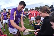 9 August 2016; Former Republic of Ireland International Niall Quinn signs autographs after the fifth annual Hurling for Cancer Research, a celebrity hurling match in aid of the Irish Cancer Society in St Conleth’s Park, Newbridge. Ireland's top GAA and horseracing stars lined out for the game, organised by horseracing trainer Jim Bolger and National Hunt jockey Davy Russell. To date the event has raised €400,000 for the Irish Cancer Society, the leading voluntary funder of cancer research in Ireland. St Conleth’s Park, Newbridge, Kildare. Photo by David Maher/Sportsfile