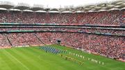 19 September 2010; A general view of the Down and Cork teams as they walk in the pre-match parade in front of the Davin Stand before the game. GAA Football All-Ireland Senior Championship Final, Down v Cork, Croke Park, Dublin. Picture credit: Brendan Moran / SPORTSFILE