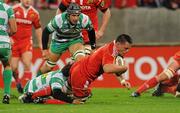 22 October 2010; James Coughlan, Munster, scores his side's first try despite the efforts of Ludovico Nitoglia, Benetton Treviso. Celtic League, Munster v Benetton Treviso, Thomond Park, Limerick. Picture credit: Diarmuid Greene / SPORTSFILE