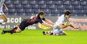 22 October 2010; Ian Whitten, Ulster, beats the tackle of Jim Thompson, Edinburgh, to score his side's first try. Celtic League, Edinburgh v Ulster, Murrayfield, Edinburgh, Scotland. Picture credit: David Gibson / SPORTSFILE