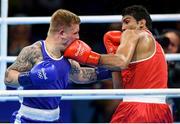 10 August 2016; Evaldas Petrauskas of Lithuania, left, in action against Manoj Kumar of India during their Men's Light Welterweight Preliminary bout at the Riocentro Pavillion 6 Arena during the 2016 Rio Summer Olympic Games in Rio de Janeiro, Brazil. Photo by Stephen McCarthy/Sportsfile