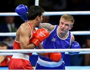 10 August 2016; Evaldas Petrauskas of Lithuania, right, in action against Manoj Kumar of India during their Men's Light Welterweight Preliminary bout at the Riocentro Pavillion 6 Arena during the 2016 Rio Summer Olympic Games in Rio de Janeiro, Brazil. Photo by Stephen McCarthy/Sportsfile