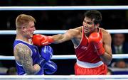10 August 2016; Evaldas Petrauskas of Lithuania, left, in action against Manoj Kumar of India during their Men's Light Welterweight Preliminary bout at the Riocentro Pavillion 6 Arena during the 2016 Rio Summer Olympic Games in Rio de Janeiro, Brazil. Photo by Stephen McCarthy/Sportsfile