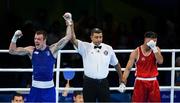 11 August 2016; Steven Donnelly of Ireland, left, is declared victorious over Tuvshinbat Byamba of Mongolia after their Welterweight preliminary round of 16 bout in the Riocentro Pavillion 6 Arena, Barra da Tijuca, during the 2016 Rio Summer Olympic Games in Rio de Janeiro, Brazil. Photo by Ramsey Cardy/Sportsfile