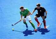 11 August 2016; Jonathan Bell of Ireland in action against Iain Smythe of Canada during the Pool B match between Ireland and Canada at the Olympic Hockey Centre, Deodoro, during the 2016 Rio Summer Olympic Games in Rio de Janeiro, Brazil. Photo by Stephen McCarthy/Sportsfile