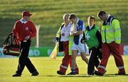 24 October 2010; Aidan Tuite, Skyrne, is helped off the field by medical personnel after receiving an injury. AIB GAA Football Leinster Club Senior Championship Quarter-Final, Skyrne v Rathnew, Pairc Tailteann, Navan, Co. Meath. Picture credit: Barry Cregg / SPORTSFILE