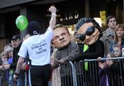 25 October 2010; Bono and Larry Mullen lookalikes cheer on a competitor as he makes his way to the finish of the Lifestyle Sports - adidas Dublin Marathon 2010, Merrion Square, Dublin. Picture credit: Barry Cregg / SPORTSFILE
