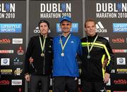 25 October 2010; Podium finishers of the Irish Men's National Marathon Championships, from left, third place Greg Roberts, City of Derry, winner Sergiu Ciobanu, Clonliffe Harriers, and Joe McAlister, from Belfast, Co. Antrim, running with St. Malachys, during the Lifestyle Sports - adidas Dublin Marathon 2010. Dublin. Picture credit: Stephen McCarthy / SPORTSFILE