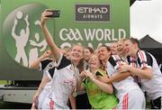 11 August 2016; The Asia Ladies Football Team take a selfie during Day 3 of the Etihad Airways GAA World Games 2016 at UCD in Dublin. Photo by Sam Barnes/Sportsfile