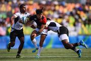 11 August 2016; Teruya Goto of Japan is tackled by Apisai Domolailai, left, and Ro Dakuwaqa of Fiji during the Men's Rugby Sevens semi-final match between Fiji and Japan during the 2016 Rio Summer Olympic Games at Deodoro Stadium in Rio de Janeiro, Brazil. Photo by Stephen McCarthy/Sportsfile