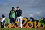 11 August 2016; Justin Rose of Great Britain consults with his caddy Mark Fulcher during Round 1 of the Men's Strokeplay competition at the Olympic Golf Course, Barra de Tijuca, during the 2016 Rio Summer Olympic Games in Rio de Janeiro, Brazil. Photo by Brendan Moran/Sportsfile