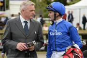 11 August 2016; Jockey Kevin Manning in conversation with Jimmy Hyland, Stud Director, Godolphin Ireland, after winning the Invesco Pension Consultants Desmond Stakes on Tribal Beat at Leopardstown Racecourse in Dublin. Photo by Cody Glenn/Sportsfile