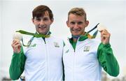 12 August 2016; Paul O'Donovan, left, and Gary O'Donovan of Ireland celebrate with their silver medals in front of the sugarloaf wountain after the Men's Lightweight Double Sculls A final in Lagoa Stadium, Copacabana, during the 2016 Rio Summer Olympic Games in Rio de Janeiro, Brazil. Photo by Brendan Moran/Sportsfile