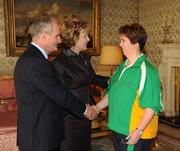 27 October 2010; TEAM Ireland member Linda Cannon, from Athenry, Co. Galway, who won a 4th place ribbon in the Women's 7-aside football at the 2010 Special Olympics European Games, with President Mary McAleese and Dr. Martin McAleese at a reception to celebrate their achievements in Aras an Uachtarain, Phoenix Park, Dublin. Picture credit: Ray McManus / SPORTSFILE