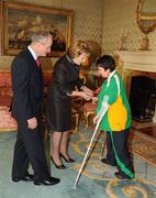 27 October 2010; TEAM Ireland member Therese Nolan, from Kilkenny, who won Gold and Bronze medals in Track and Field events at the 2010 Special Olympics European Games, with President Mary McAleese and Dr. Martin McAleese at a reception to celebrate their achievements in Aras an Uachtarain, Phoenix Park, Dublin. Picture credit: Ray McManus / SPORTSFILE