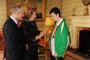 27 October 2010; TEAM Ireland member Niall Flynn, from Dunlaoighre, Co. Dublin, who won a Silver medal in the 50m race and Gold medal in the softball throw competition at the 2010 Special Olympics European Games, with President Mary McAleese and Dr. Martin McAleese at a reception to celebrate their achievements in Aras an Uachtarain, Phoenix Park, Dublin. Picture credit: Ray McManus / SPORTSFILE