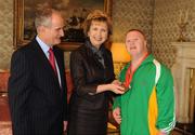 27 October 2010; TEAM Ireland member Mark Bolger, from Abbeydorney, Co. Kerry, who won 1 gold, 1 silver and 1 bronze medal in the athletics competition at the 2010 Special Olympics European Games, with President Mary McAleese and Dr. Martin McAleese at a reception to celebrate their achievements in Aras an Uachtarain, Phoenix Park, Dublin. Picture credit: Ray McManus / SPORTSFILE