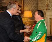 27 October 2010; TEAM Ireland member Hugh Mohan, from Tubbercurry, Co. Sligo, who won Gold in the 400m walk and silver in the 800m walk in the athletics competition at the 2010 Special Olympics European Games, with President Mary McAleese and Dr. Martin McAleese at a reception to celebrate their achievements in Aras an Uachtarain, Phoenix Park, Dublin. Picture credit: Ray McManus / SPORTSFILE