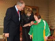 27 October 2010; TEAM Ireland member Cathy Fitzgerald, from Carlow, who won a Silver medal in the softball throw competition and a bronze medal in the 50m race at the 2010 Special Olympics European Games, with President Mary McAleese and Dr. Martin McAleese at a reception to celebrate their achievements in Aras an Uachtarain, Phoenix Park, Dublin. Picture credit: Ray McManus / SPORTSFILE