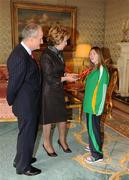 27 October 2010; TEAM Ireland member Breffni McCarthy, from Palmerstown, Dublin, who won a Silver medal in the 100m race at the 2010 Special Olympics European Games, with President Mary McAleese and Dr. Martin McAleese at a reception to celebrate their achievements in Aras an Uachtarain, Phoenix Park, Dublin. Picture credit: Ray McManus / SPORTSFILE
