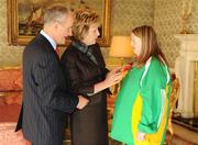 27 October 2010; TEAM Ireland member Ruth Geerah, from Mullingar, Co. Westmeath, who won a Silver medal in the Badminton Singles at the 2010 Special Olympics European Games, with President Mary McAleese and Dr. Martin McAleese at a reception to celebrate their achievements in Aras an Uachtarain, Phoenix Park, Dublin. Picture credit: Ray McManus / SPORTSFILE
