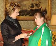 27 October 2010; TEAM Ireland member Emma Chalmers, from Portrush, Co. Antrim, who won a Bronze in Bowling doubles, Bronze in Bowling singles Gold in team bowling event at the 2010 Special Olympics European Games, with President Mary McAleese at a reception to celebrate their achievements in Aras an Uachtarain, Phoenix Park, Dublin. Picture credit: Ray McManus / SPORTSFILE