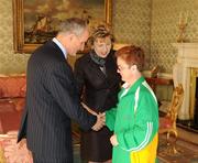 27 October 2010; TEAM Ireland member Kim Byrne, from Thurles, Co. Tipperary, who earned a 4th place ribbon  in the Women’s 7-aside football at the 2010 Special Olympics European Games, with President Mary McAleese and Dr. Martin McAleese at a reception to celebrate their achievements in Aras an Uachtarain, Phoenix Park, Dublin. Picture credit: Ray McManus / SPORTSFILE