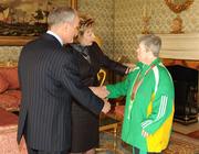 27 October 2010; TEAM Ireland member Doreen McGreevy, from Friar’s Walk, Cork City, who won a Bronze medal in the table tennis doubles competition and received a 7th place position in the singles event at the 2010 Special Olympics European Games, with President Mary McAleese and Dr. Martin McAleese at a reception to celebrate their achievements in Aras an Uachtarain, Phoenix Park, Dublin. Picture credit: Ray McManus / SPORTSFILE