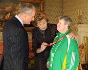 27 October 2010; TEAM Ireland member Doreen McGreevy, from Friar’s Walk, Cork City, who won a Bronze medal in the table tennis doubles competition and received a 7th place position in the singles event at the 2010 Special Olympics European Games, with President Mary McAleese and Dr. Martin McAleese at a reception to celebrate their achievements in Aras an Uachtarain, Phoenix Park, Dublin. Picture credit: Ray McManus / SPORTSFILE