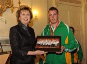 27 October 2010; TEAM Ireland member Philip Patton, from Dromore, Co. Down, who won a Bronze in Table Tennis doubles, and came 7th place in table tennis singles at the 2010 Special Olympics European Games, presents President Mary McAleese with a picture at a reception to celebrate their achievements in Aras an Uachtarain, Phoenix Park, Dublin. Picture credit: Ray McManus / SPORTSFILE
