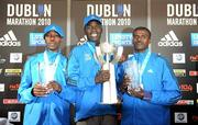 25 October 2010; Mens winner Moses Kangogo Kibet, Kenya, who won in a record time of 2:08:58, centre, with second place Fikadu Kedir, from Ethopia, right, and third place Mourice Mutinda Musyoki, from Kenya, at the Lifestyle Sports - adidas Dublin Marathon 2010. Dublin. Picture credit: Stephen McCarthy / SPORTSFILE