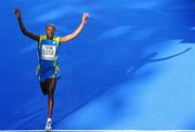 25 October 2010; Mourice Mutinda Musyoki, from Kenya, celebrates taking third place during the Lifestyle Sports - adidas Dublin Marathon 2010. Dublin. Picture credit: Stephen McCarthy / SPORTSFILE