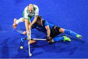 12 August 2016; Peter Caruth of Ireland in action against Lucas Rossi of Argentina during the Pool B match between Ireland and Argentina at the Olympic Hockey Centre, Deodoro, during the 2016 Rio Summer Olympic Games in Rio de Janeiro, Brazil. Photo by Stephen McCarthy/Sportsfile