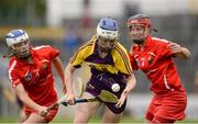 13 August 2016; Úna Sinnott of Wexford in action against Meabh Cahalane, left, and Leanne O'Sullivan of Cork during the Liberty Insurance Senior Camogie Championship Semi-Final game between Cork and Wexford at Semple Stadium in Thurles, Co Tipperary. Photo by Piaras Ó Mídheach/Sportsfile