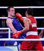 13 August 2016; Steven Donnelly of Ireland, left, in action against Mohammed Rabii of Morocco during their Welterweight preliminary round of 32 bout in the Riocentro Pavillion 6 Arena during the 2016 Rio Summer Olympic Games in Rio de Janeiro, Brazil. Photo by Stephen McCarthy/Sportsfile