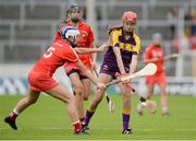 13 August 2016; Sarah O'Connor of Wexford in action against Meabh Cahalane and Orla Cotter, behind, of Cork during the Liberty Insurance Senior Camogie Championship Semi-Final game between Cork and Wexford at Semple Stadium in Thurles, Co Tipperary. Photo by Piaras Ó Mídheach/Sportsfile