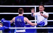 13 August 2016; Referee Rakhymzhan Rysbayev of Kazakhstan with Steven Donnelly of Ireland during his Welterweight preliminary round of 32 bout defeat to Mohammed Rabii of Morocco in the Riocentro Pavillion 6 Arena during the 2016 Rio Summer Olympic Games in Rio de Janeiro, Brazil. Photo by Stephen McCarthy/Sportsfile